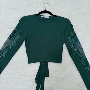 Green girly sweater with an open back, and lace arm details. Never worn